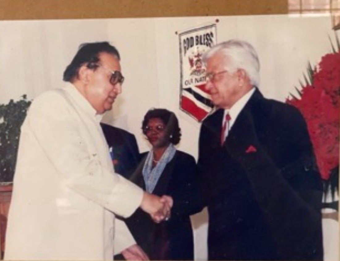 Prime Minister Basdeo Panday congratulating Prof. Hari Shanker Adesh at the 2001 National Awards