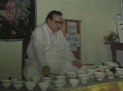 Prof. H. S. Adesh playing Jaltarang at BVS Camp