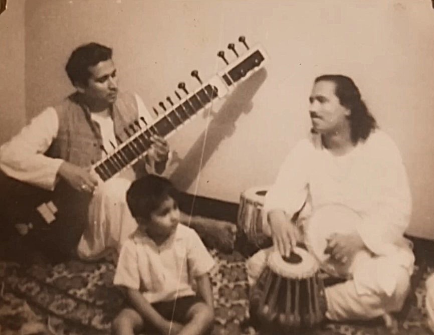 Prof. Hari Shanker Adesh playing sitar accompanied on tabla by Sant Keshavdas in 1969, with young Vivek Adesh